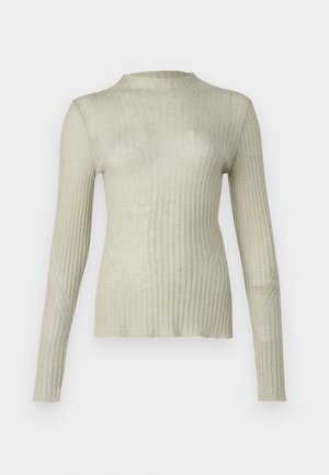 Kerge beež ribakujuline pikakäistega topp kõrge kaelusega. Valmistatud pehmest, tekstuuriga kangast. Omab diagonaalseid õmblusi varrukatel.