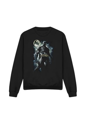 Schwarzer Pullover mit einem Grafikmotiv von Batman, der vor einem mondbeleuchteten Himmel steht und dem Bat-Signal, das hinter ihm leuchtet.