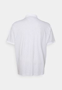 White polo shirt with black dotted pattern, short sleeves, and a collar. The fabric appears smooth and lightweight.