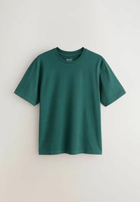 T-shirt vert foncé à manches courtes avec col rond, coupe régulière, présenté sur un fond clair uni.