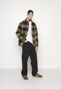 Carhartt WIP LANDON PANT - Jeans relaxed fit - black