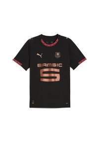Juodas futbolo marškinėlis trumpomis rankovėmis. Yra raudonos ir raštuotos detalės ant apykaklės ir rankovių. Priekyje yra auksinė logotipas ir užrašai.
