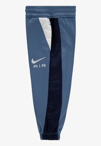 Nike sport benærming, blåt stof, med hvid og navy accent, ribbet kant og "AIR" logo i hvid på siden.