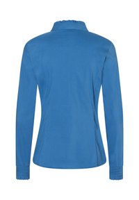 Blue long-sleeve blouse with a ruffled collar, fitted shape, and smocked cuffs, made from a smooth fabric with a solid color.