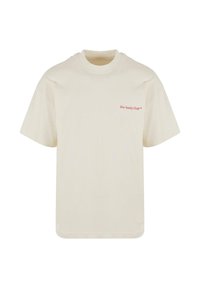 Tricou crem cu mâneci scurte, decolteu rotund și text mic roșu „Slow Sunday Club™“ pe pieptul stâng.