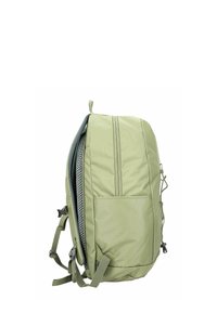 Zaino verde chiaro con schienale imbottito, spallacci regolabili, tasca frontale e cinghie di compressione laterali, mostrato di lato.