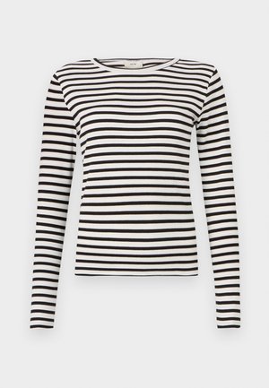 Svart-og-hvitt stripete langermet skjorte med rund hals og tettsittende ribbestruktur. Balansert stripebredde gjennom hele skjorten.