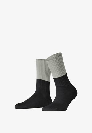 Black and gray ribbed socks with a contrasting light gray cuff. The design features a smooth texture and a classic shape.