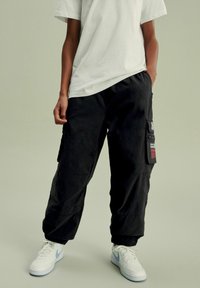 Next - NASA -REGULAR FIT - Cargohose - black Thumbnail-Bild 1