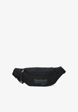 Riñonera negra de Reebok con compartimento principal con cremallera y correa ajustable, con el logo de Reebok en gris en el frente.