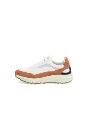 Sneaker with a white mesh upper, brown suede accents, and a blue and orange heel. Features a thick, textured cream sole.