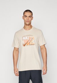 Nike Performance - COURT TEE - T-Shirt sport - sanddrift Immagine in miniatura 1