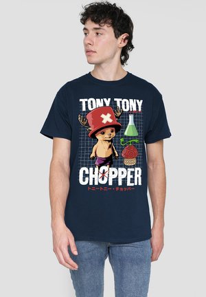 Navy blue T-shirt featuring a graphic of a cartoon character with antlers and a red hat, accompanied by green and red scientific icons.