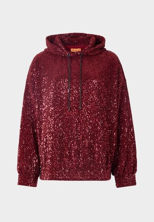 Red sequined hoodie with a high neck and adjustable drawstrings. Features ribbed cuffs and hem, showcasing a textured, shiny surface.