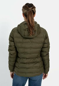 Puffer jacket in dark olive green, featuring stitched panels, a hood, and a relaxed fit. The back shows textured fabric with a smooth finish.