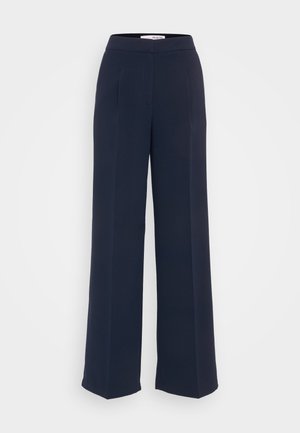Pantalones de pierna ancha de talle alto en color marino, confeccionados en una tela suave, con pliegues, un frente plano y un diseño limpio sin herrajes visibles.