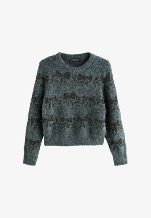 Hallide hallid kootud sviiter pika varrukaga, ümmarguse kaeluse ja tekstuuriga mustade kaariste mustriga, millel on ees helmeid.