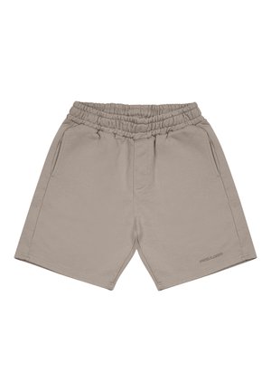 Beige bomullsshortser med elastisk midjebånd, to sidelommer og sømmer. Har en subtil logo nær bunnkanten.