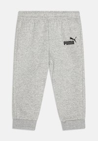 Pantalon de survêtement gris en tissu de coton mélangé, avec une taille élastique et des poignets côtelés, portant un logo Puma noir sur le côté.