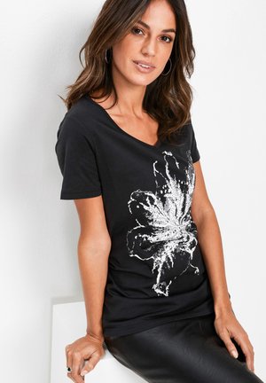 T-shirt con stampa - schwarz