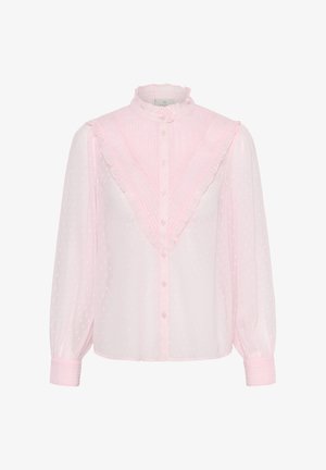 Blouse rose pâle transparente avec motif à points texturés, panneau avant en V froncé, col montant, fermeture boutonnée et manches longues bouffantes avec poignets.