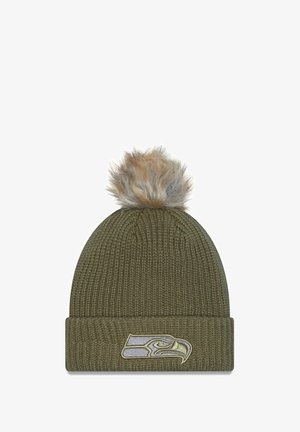 Olive green knit beanie with ribbed texture, featuring a faux fur pom-pom and a Seattle Seahawks embroidered logo on the cuff.