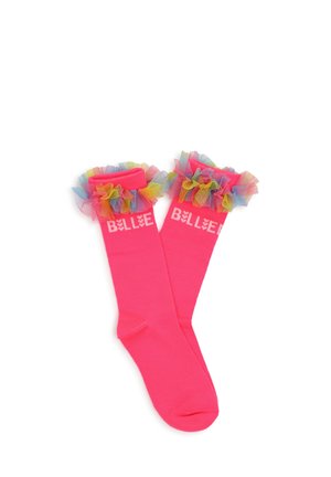 Chaussettes hautes roses vives avec des volants en tulle multicolores en haut et un texte blanc "BELLE" près du bord-côte.
