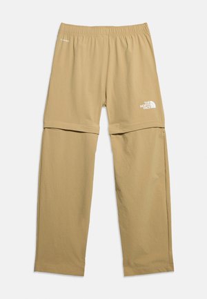 Bézs színű, levehető térdű, gumis derékpánttal rendelkező, terepen viselhető nadrág, bal combján a The North Face logójával.