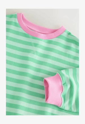 Csíkos pulóver mentazöld és halványzöld árnyalatokban, rózsaszín bordázott nyakkal és mandzsettákkal. A nyakrésznél texturált hímzési részlettel.