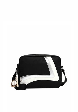 Black crossbody bag with angled white stripe and baseball-themed keychain including a glove, ball, and bat attached to the strap.