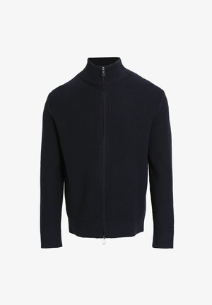 Marineblauwe geribbelde gebreide ritssluiting trui met hoge kraag en lange mouwen. Voorzien van een zilveren rits en een slim-fit ontwerp met een gestructureerd oppervlak.