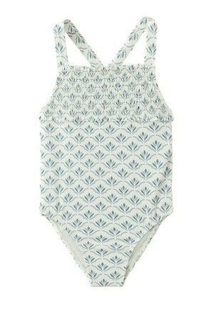 Otroški brezrokavni enodelni kopalni kostim z nabranim prsnim delom in modrim cvetličnim vzorcem na belem blagu, z zakrižanimi ramenskimi trakovi.