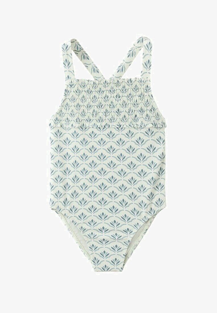 Costum de baie pentru copii, fără mâneci, cu un singur corp, cu piept plisat și model floral albastru pe țesătură albă, cu bretele încrucișate la umeri.