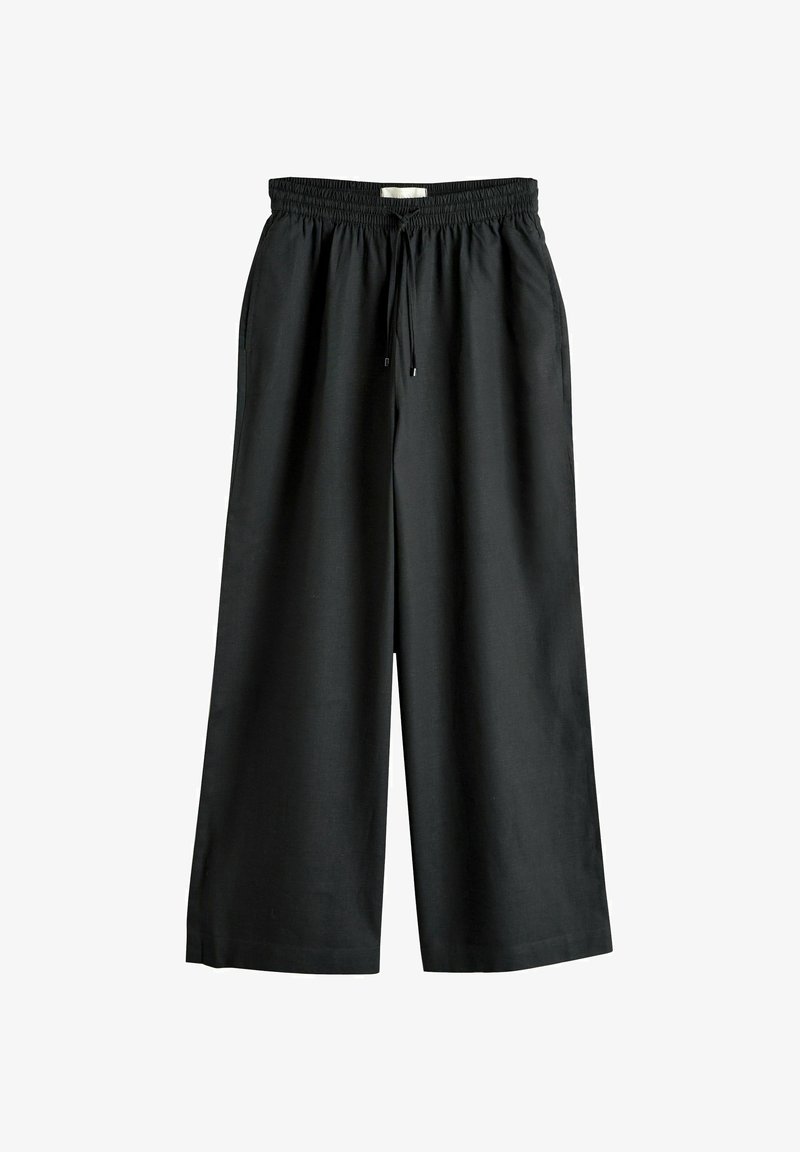 Pantalon noir à jambes larges avec taille élastique et cordon de serrage, doté de poches latérales et d'une coupe ample et décontractée.