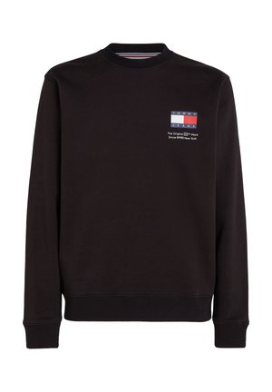 Czarna bluza z długim rękawem z prążkowanymi ściągaczami i dołem, z małym logo Tommy Jeans i napisem na lewej piersi.