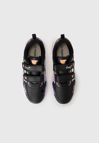 Black sneakers with pink and yellow graphic accents, dual Velcro straps, circular perforations, and a white translucent sole.