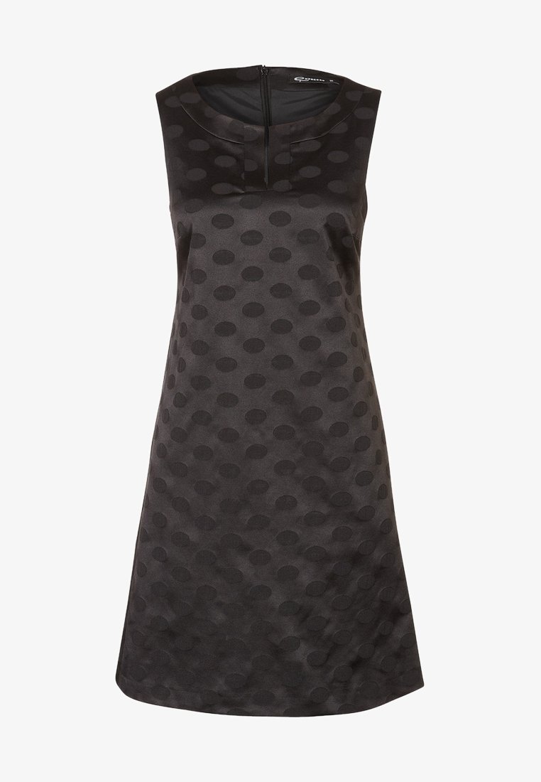 Robe noire sans manches en tissu texturé avec des motifs de pois en relief, un col rond et une fermeture éclair au dos.