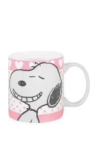 Mug in ceramica bianca con un personaggio di cane a cartone animato con un'espressione sorridente. Accenti rosa con motivi a cuori e a pois decorano il mug.