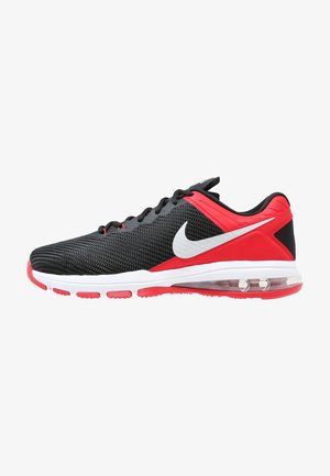 Chaussure de course Nike noire et rouge avec swoosh blanc, empeigne en mesh, semelle à coussin d’air et accents rouges sur la semelle extérieure, vue de côté.