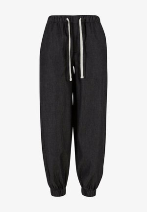 Schwarze Jogginghosen aus weichem Stoff, mit einem elastischen Bund und Kordelzügen, mit gerippten Knöcheln und einem lockeren Schnitt.