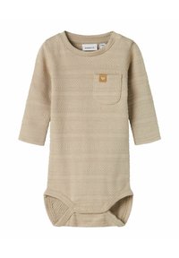 Long-sleeve bodysuit in light beige, textured fabric with horizontal stripes, featuring a small chest pocket and snap closures at the bottom.