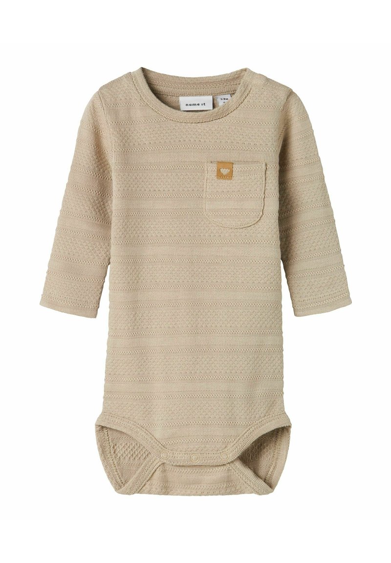 Long-sleeve bodysuit in light beige, textured fabric with horizontal stripes, featuring a small chest pocket and snap closures at the bottom.