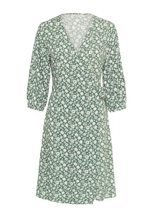 Vestito avvolgente floreale verde realizzato in tessuto leggero, caratterizzato da scollatura a V, maniche 3/4 e vita definita con dettaglio con fiocco. Motivo di margherite bianche.