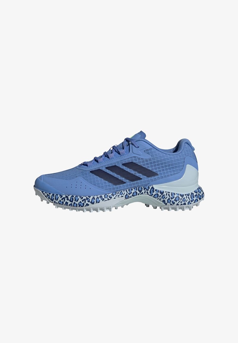 Light blue running shoe with a textured upper, navy accents, and a leopard print midsole. Features a cushioned sole and perforated ventilation.
