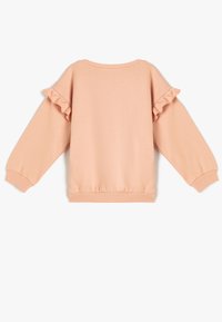 Peachfarvet sweatshirt med flæse detaljer på ærmerne, ribbede manchetter og kant, samt en rund udskæring; lavet af blødt stof.