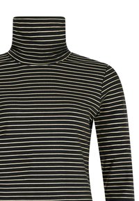 Col roulé noir et or rayé avec un col haut, des manches longues et un tissu doux et texturé idéal pour le superposition.