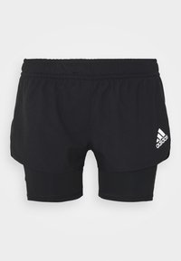 Černé sportovní šortky s vnitřní vrstvou. Elastický pás, dvouvrstvý design, na spodní pravé straně je bílý logo Adidas.