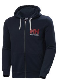 Sudadera con cremallera en color navy, con un cordón gris, bolsillos frontales y un logotipo rojo y blanco de "Helly Hansen" en el lado izquierdo del pecho. Material suave.