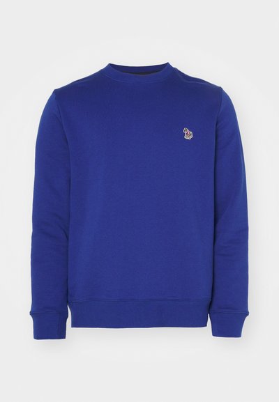 Blue sweatshirt made from soft fabric, featuring a round neckline and ribbed cuffs. It has a small embroidered logo on the chest.