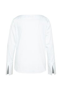 Camicia bianca a maniche lunghe con taglio dritto, fessure laterali ai polsini e finitura in tessuto liscia. Design pulito e minimalista senza ornamenti.